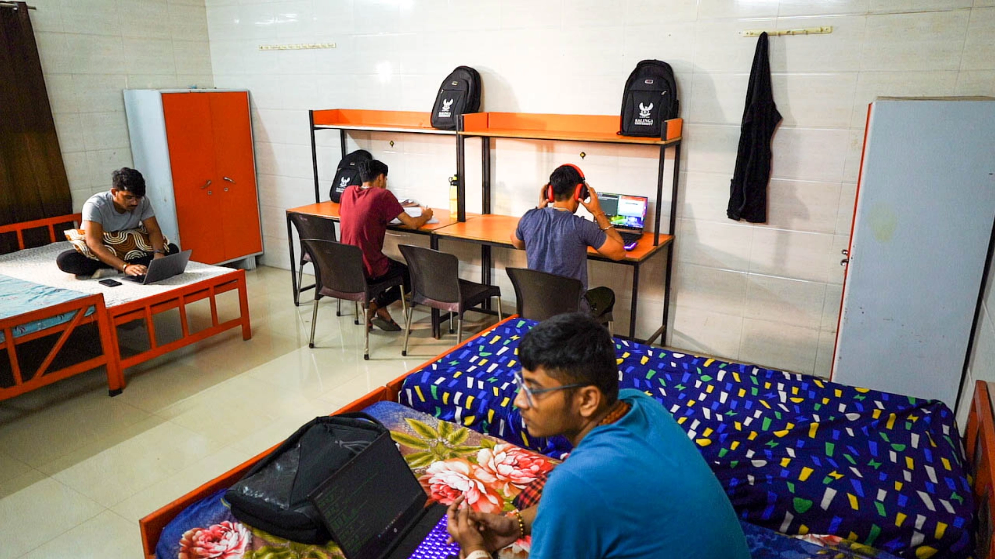 Students studying in a hostel room